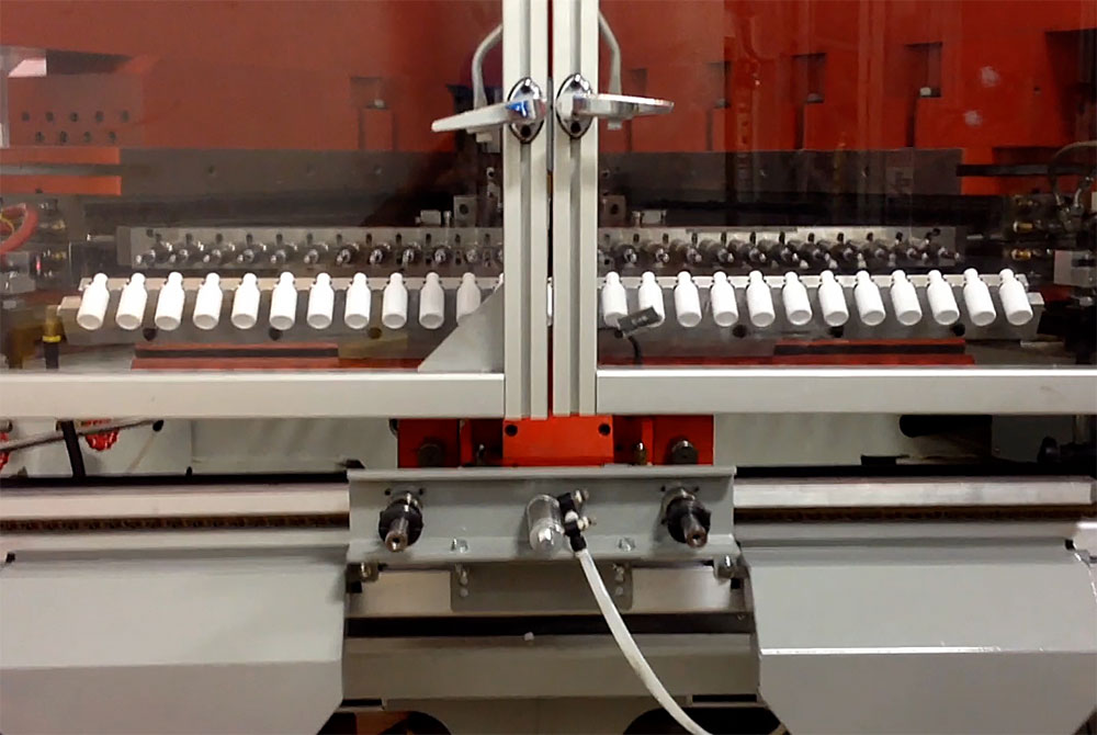 Small bottles in a blow mold takeaway system