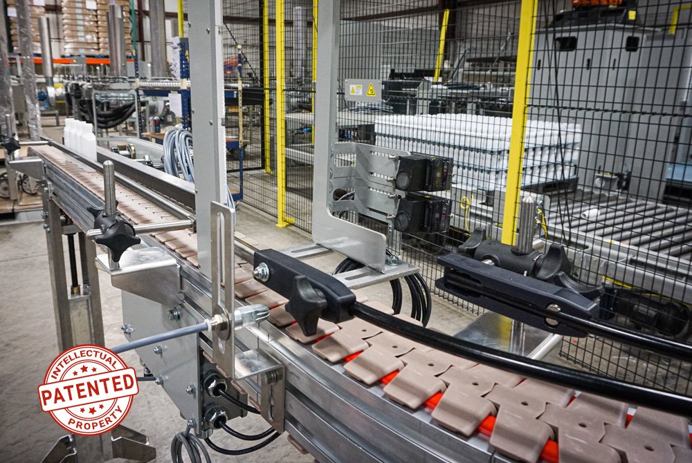 Dyco Inc's patented Red Line Table Top Conveyor for plastic containers