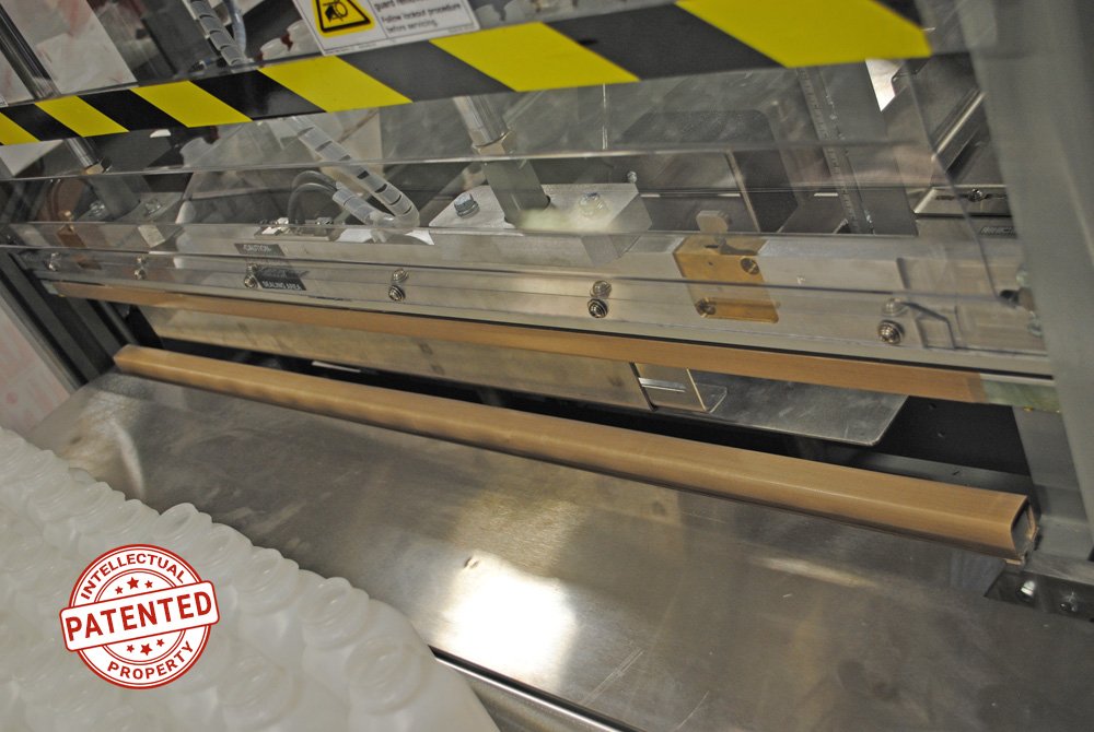 Patented Lightning Bars for Dyco Inc's Semi-Automatic Bottle Bagging machine for plastic bottles